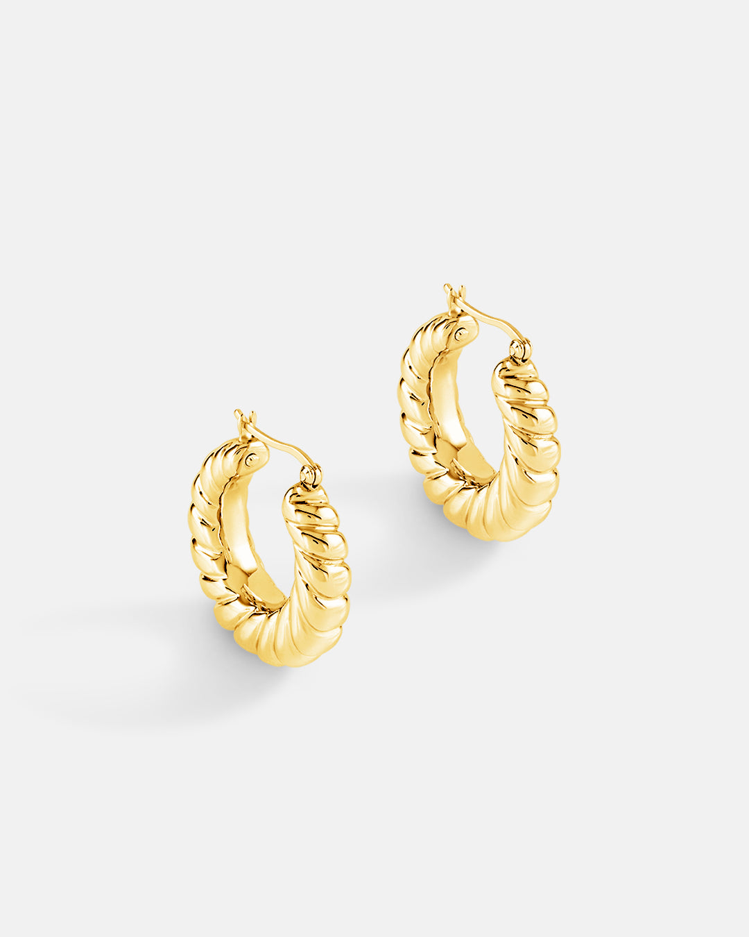 This is the product picture of classic twisted hoop earrings plated in gold in sterling silver material