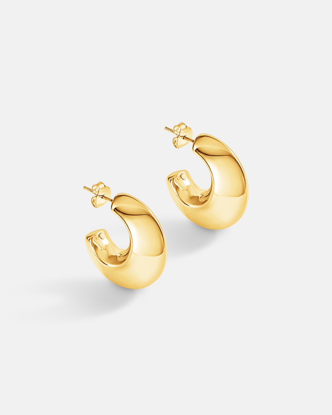 This is the product picture of chunky hoop earrings plated in gold in sterling silver material