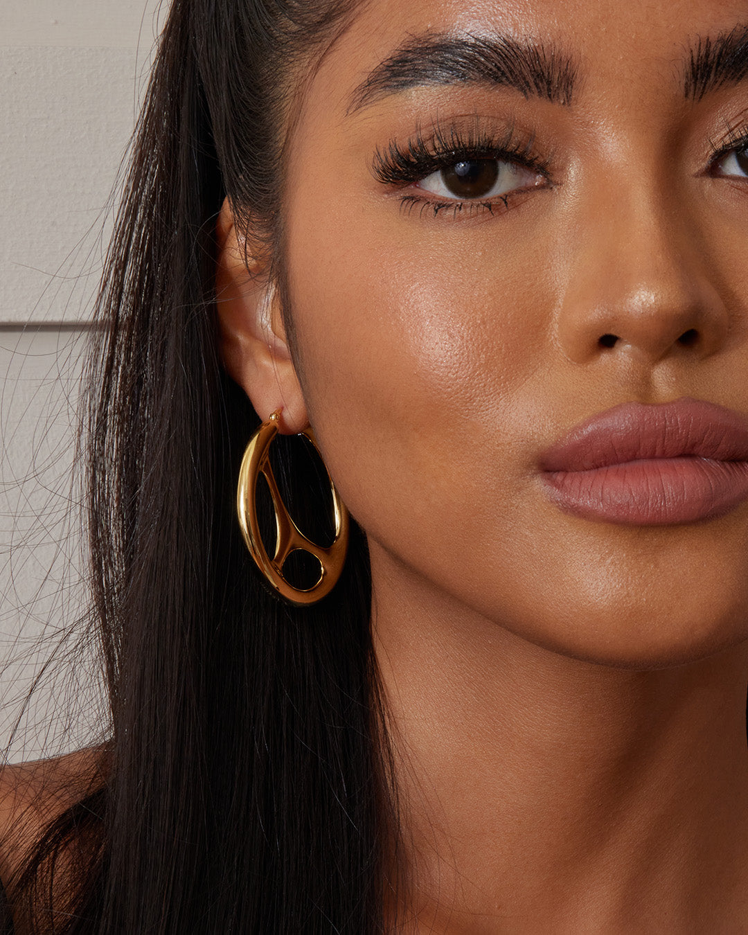 This is the product picture of unique hoop earrings plated in gold in sterling silver material