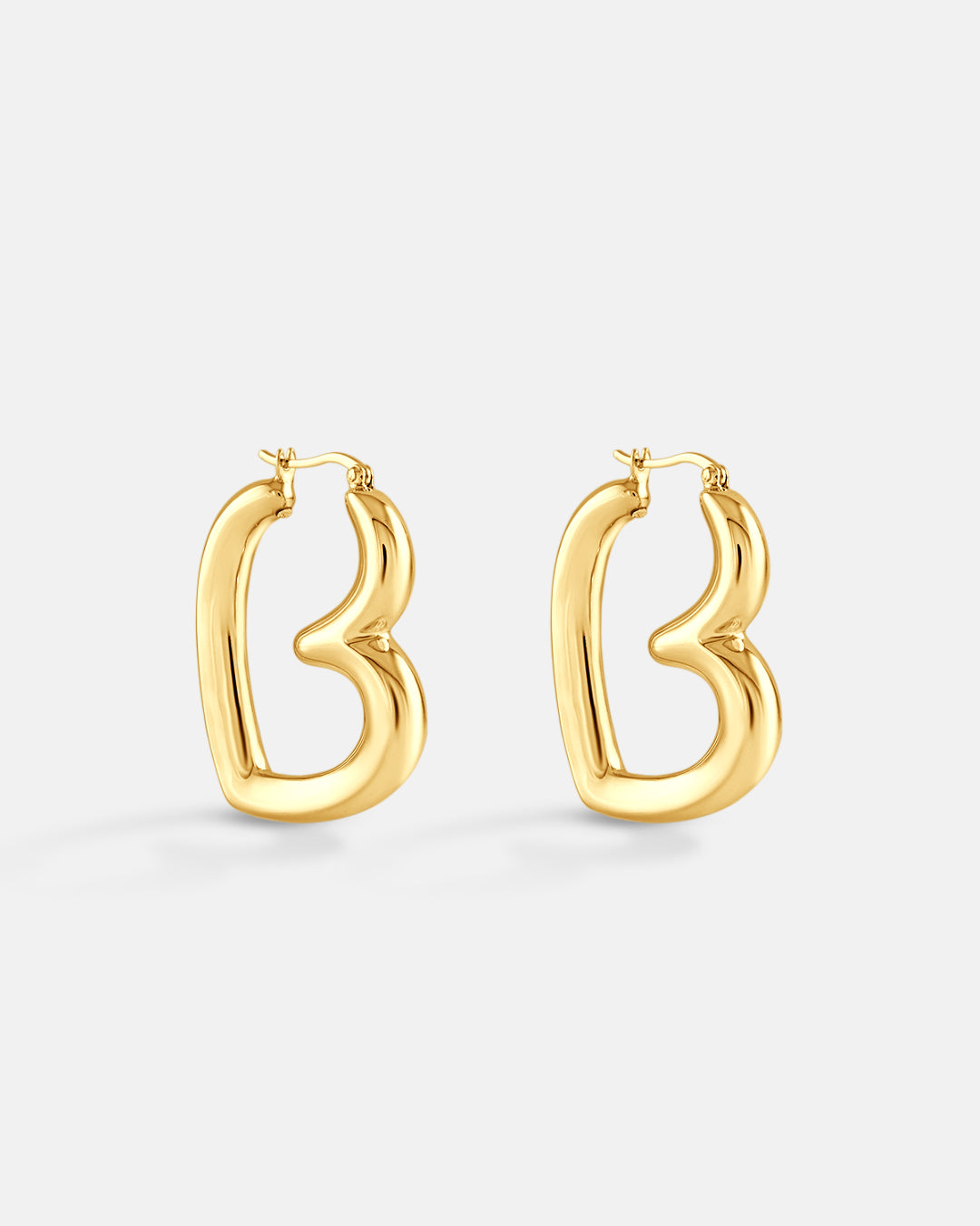 This is the product picture of a freeform design hoop earrings plated in gold in sterling silver material