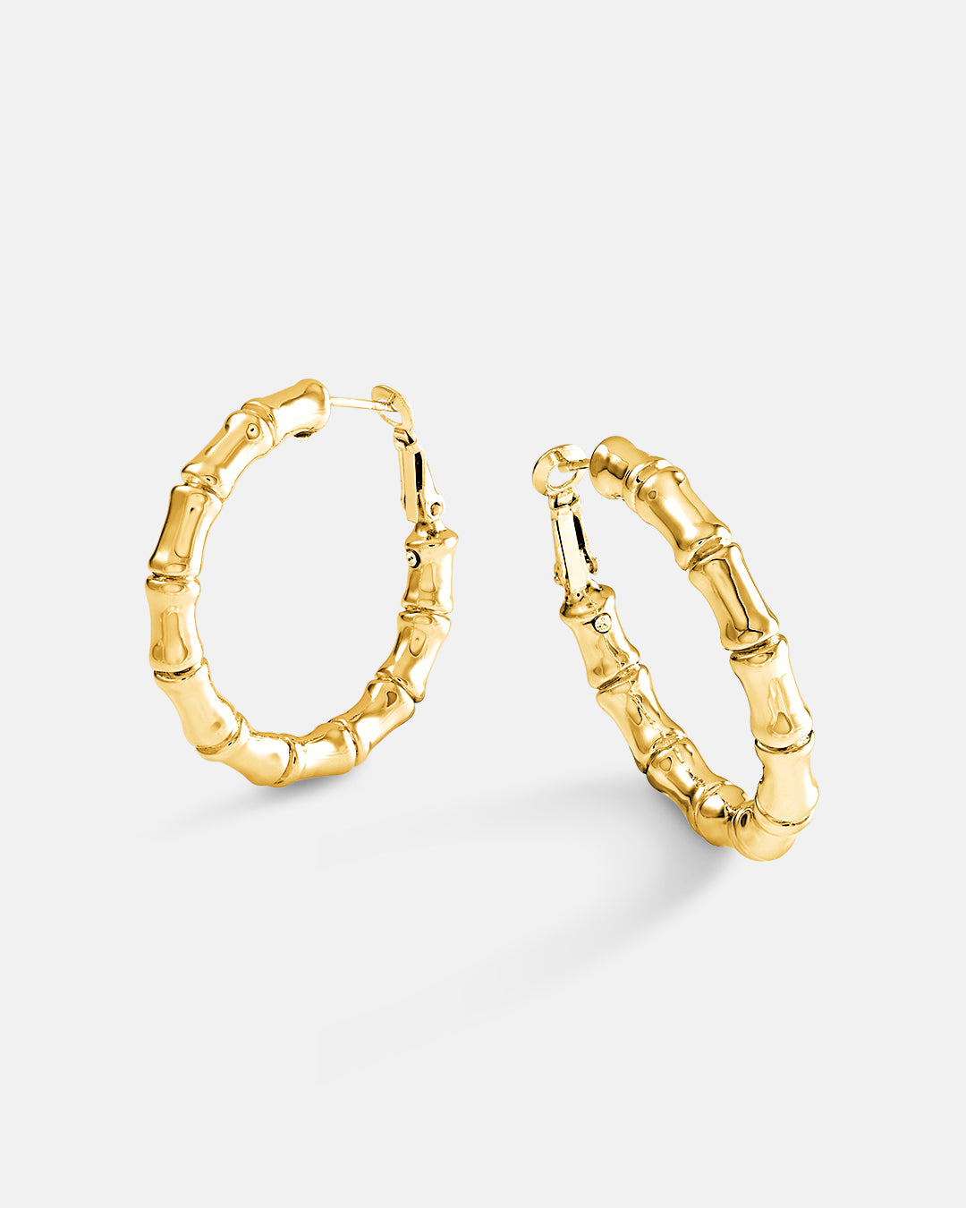This is the product picture of bamboo style hoop earrings plated in gold in sterling silver material