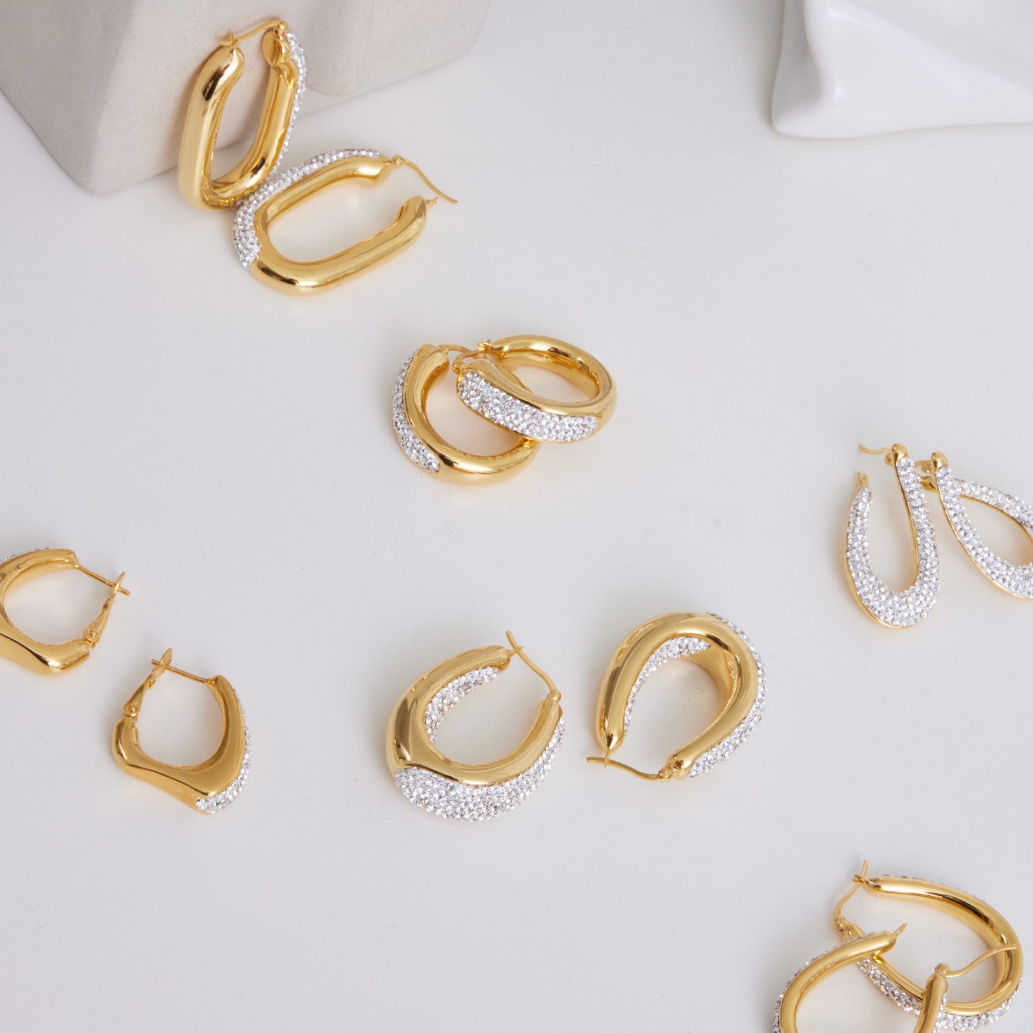 A collection of gold plated hoop earrings set with crystal used for collection picture