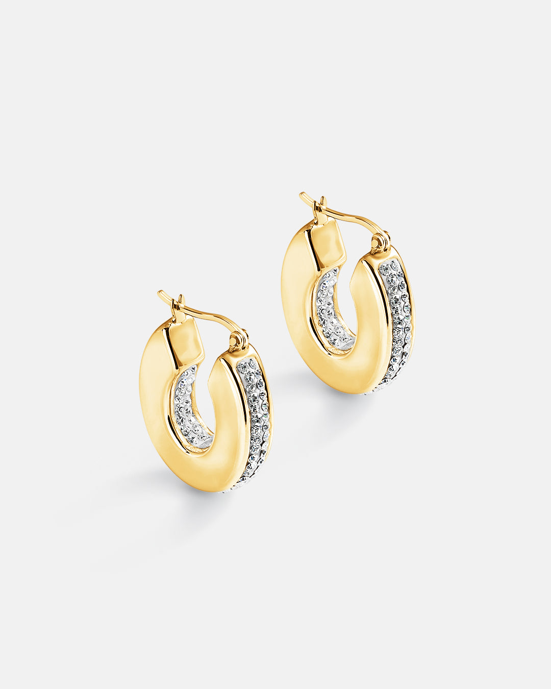 This is the product picture of chunky hoop earrings with micro pavé crystals plated in gold in sterling silver material