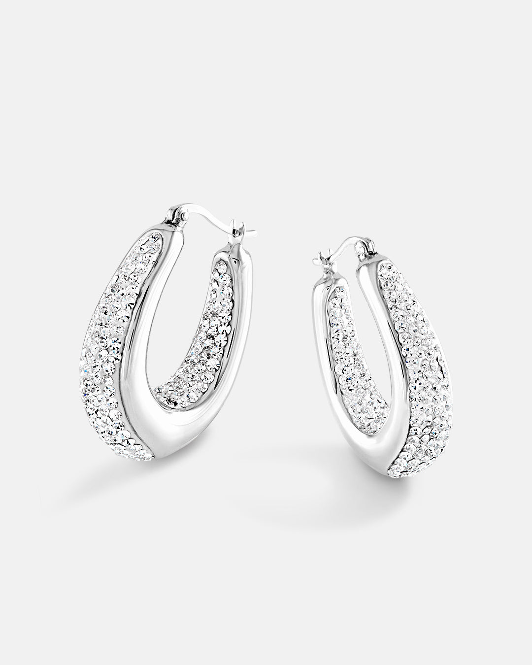 This is the product picture of chunky elegant hoop earrings with crystals plated in white gold in sterling silver material