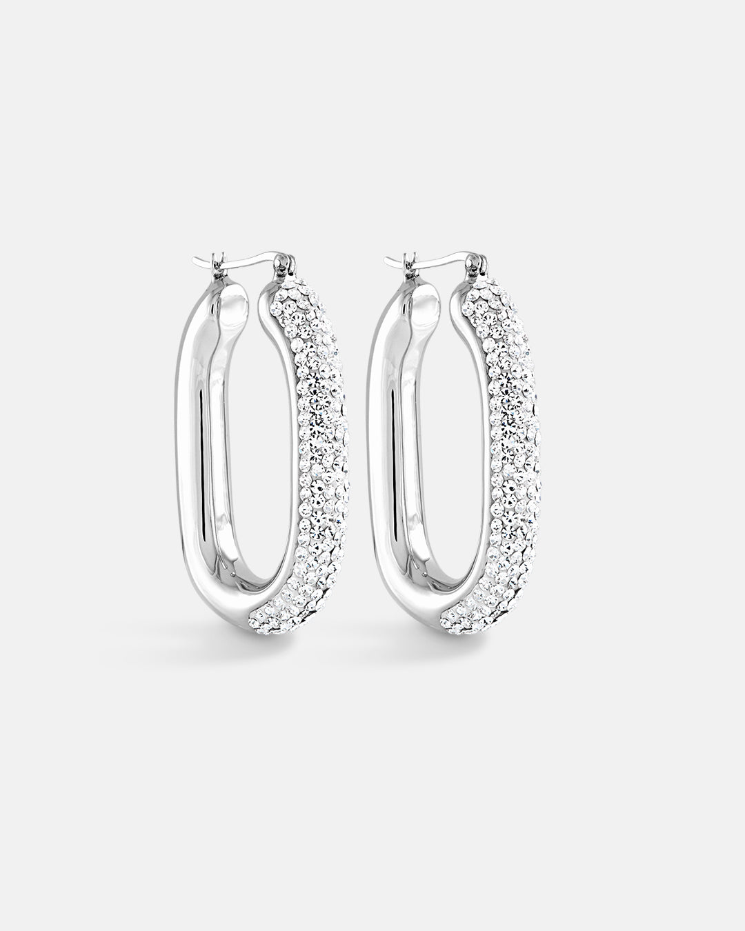 This is the product picture of elegant hoop earrings with micro pavé crystals plated in white gold in sterling silver material