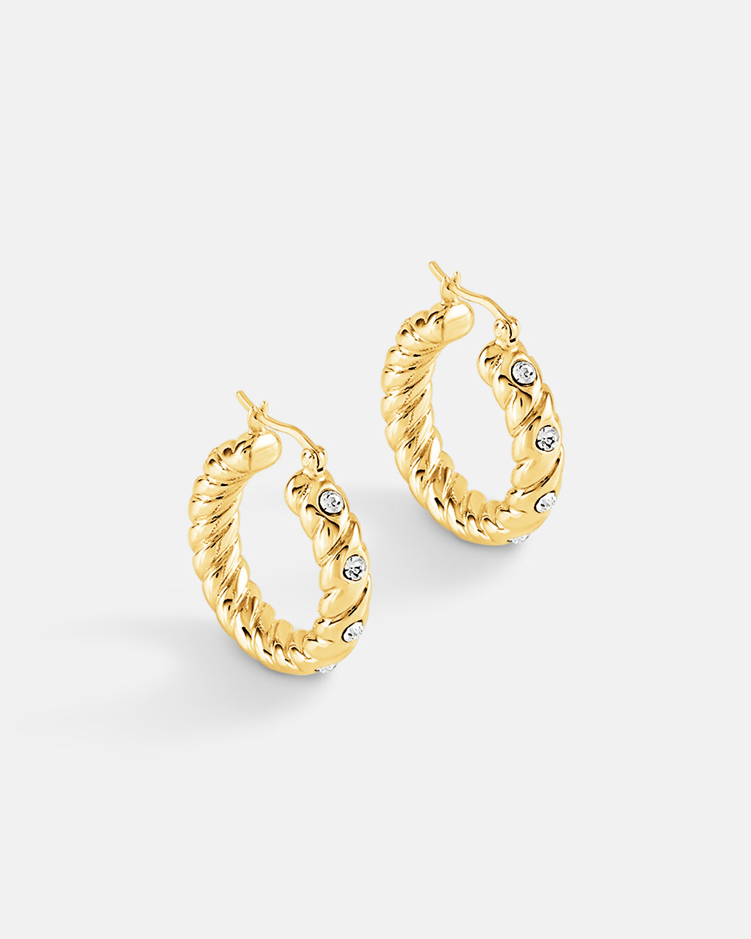 This is a product picture of a classical twisted rope pattern design with accented crystal set around the hoops earrings plated in gold in sterling silver material 