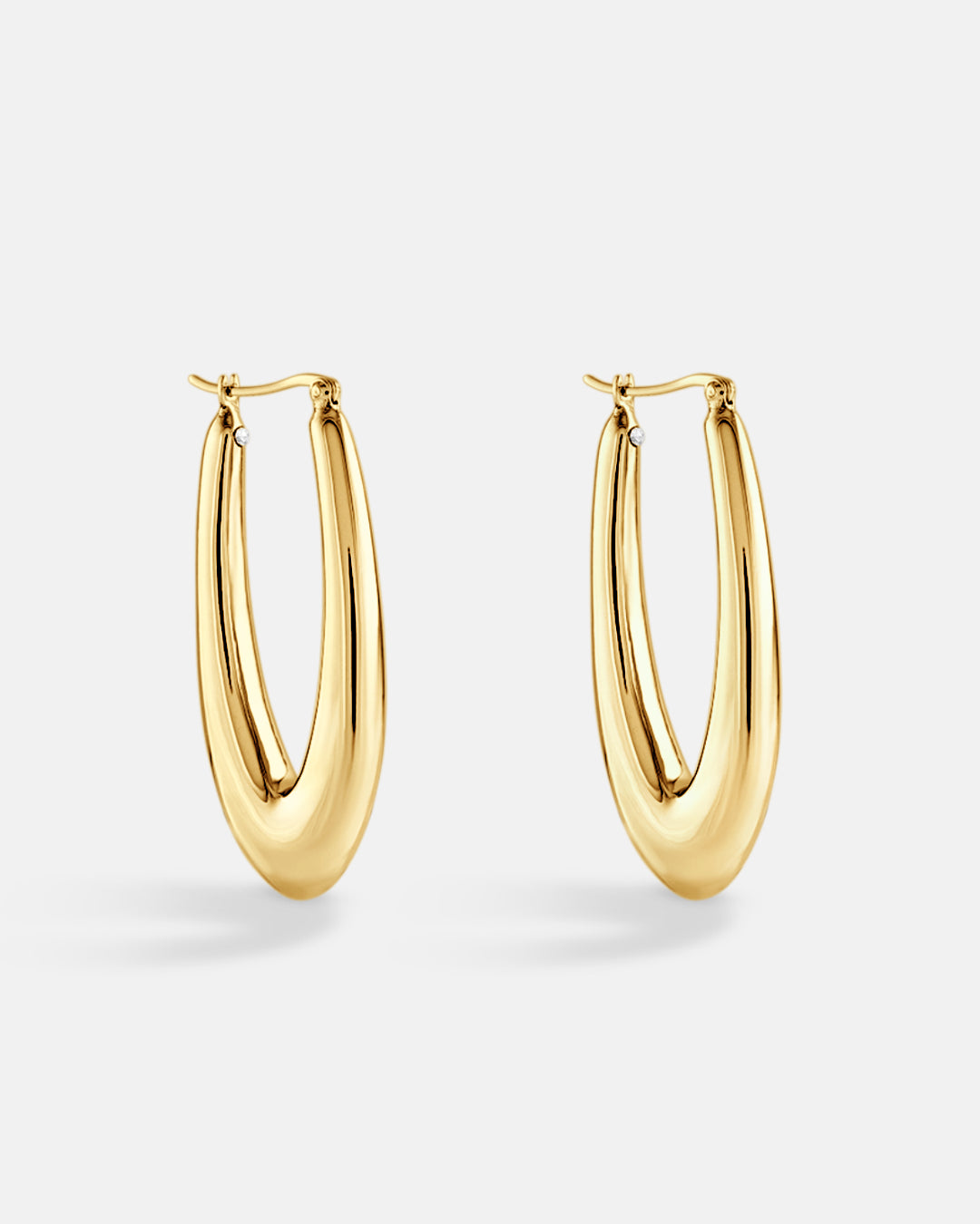 This is the product picture of elongated style hoop earrings plated in gold in sterling silver material 