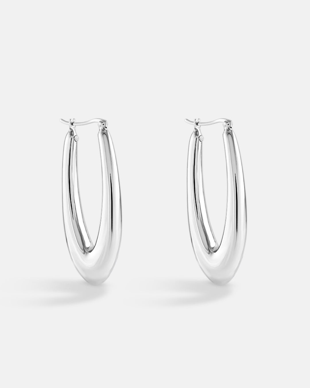 This is the product picture of elongated style hoop earrings plated in gold in sterling silver material 