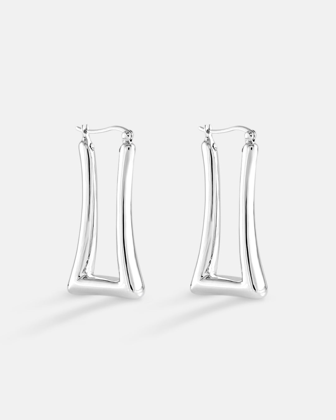 This is the product picture of elongated rectangular shape hoop earrings plated in white gold in sterling silver material