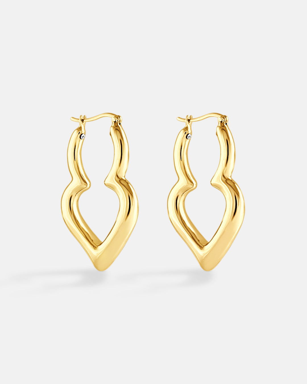 This is the product picture of elongated freeform shaped hoop earrings plated in gold in sterling silver material