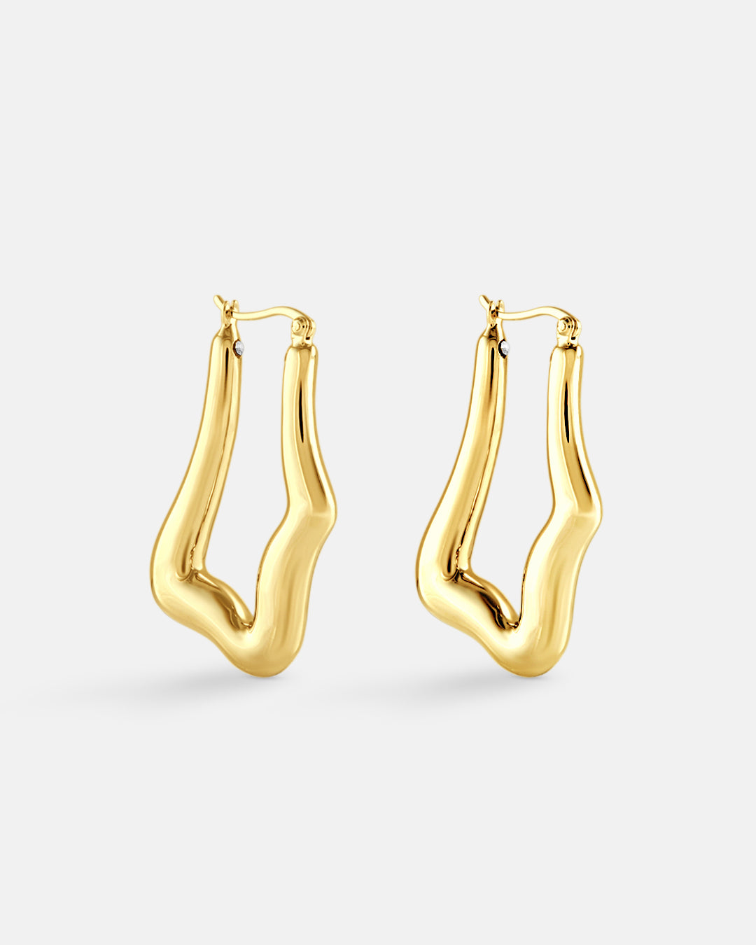 This is the product picture of organic shape elongated style hoop earrings plated in gold in sterling silver material 