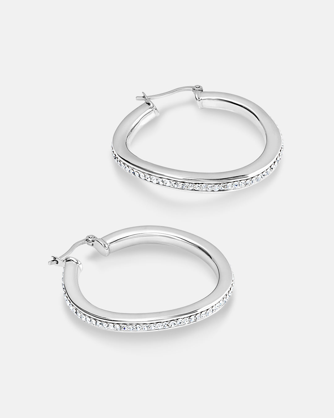 This is the product picture of a slight free form twist hoop earrings with micro pavé crystals plated in white gold in sterling silver material