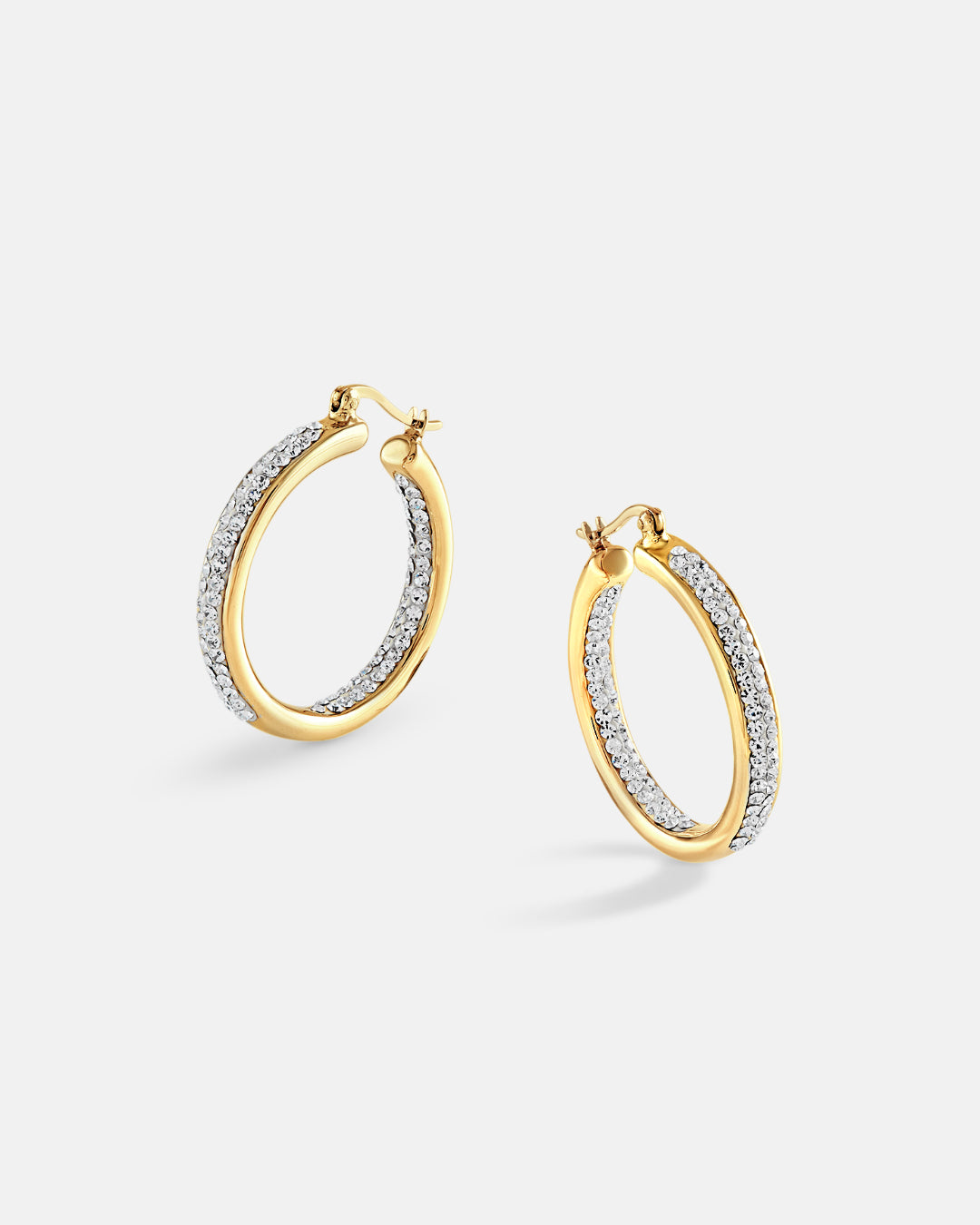 This is the product picture of elegant hoop earrings with micro pavé crystals plated in gold in sterling silver material