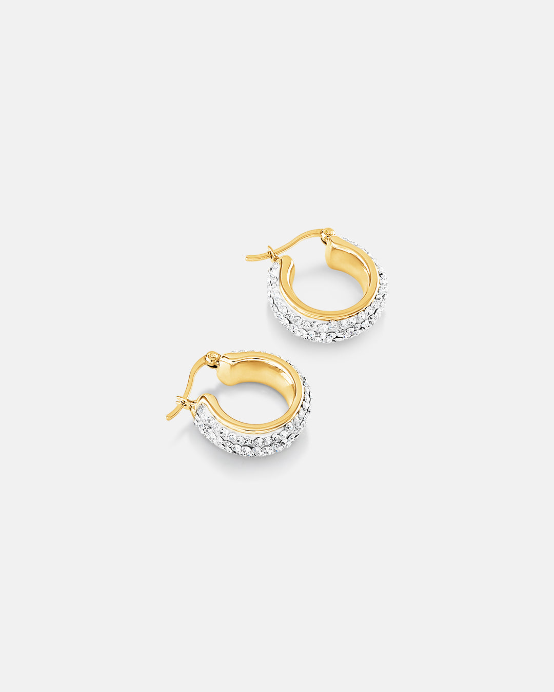 This is the product picture of small elegant hoop earrings with micro pavé crystals plated in gold in sterling silver material