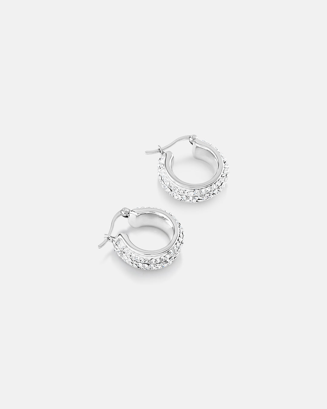 This is the product picture of small elegant hoop earrings with micro pavé crystals plated in white gold in sterling silver material