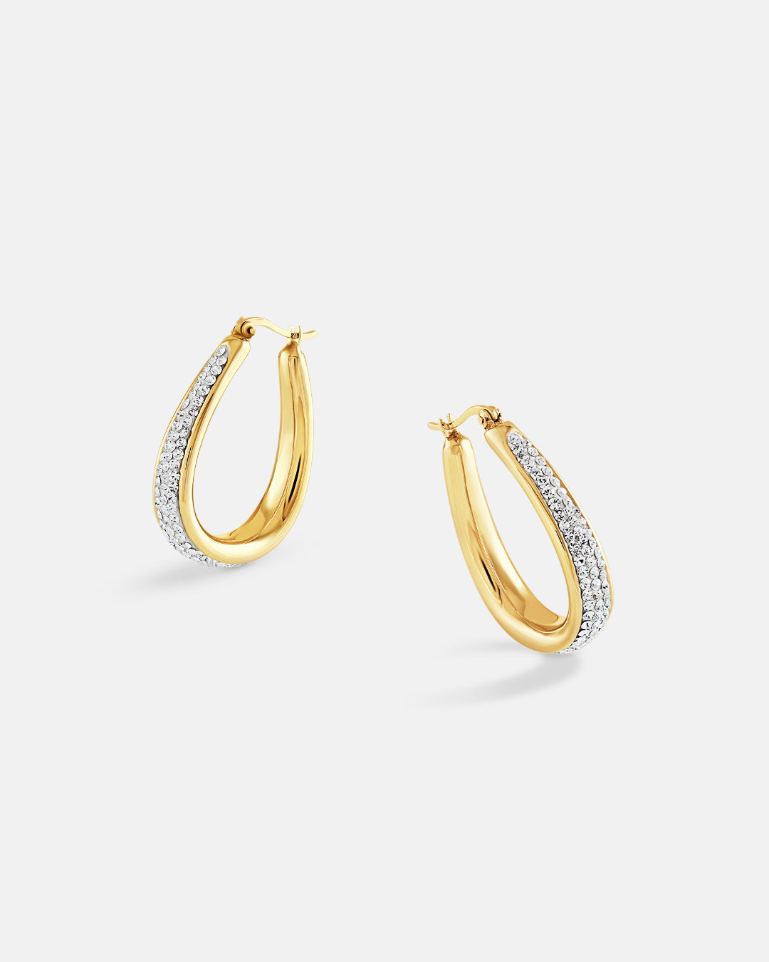 This is the product picture of elegant hoop earrings with micro pavé crystals plated in gold in sterling silver material