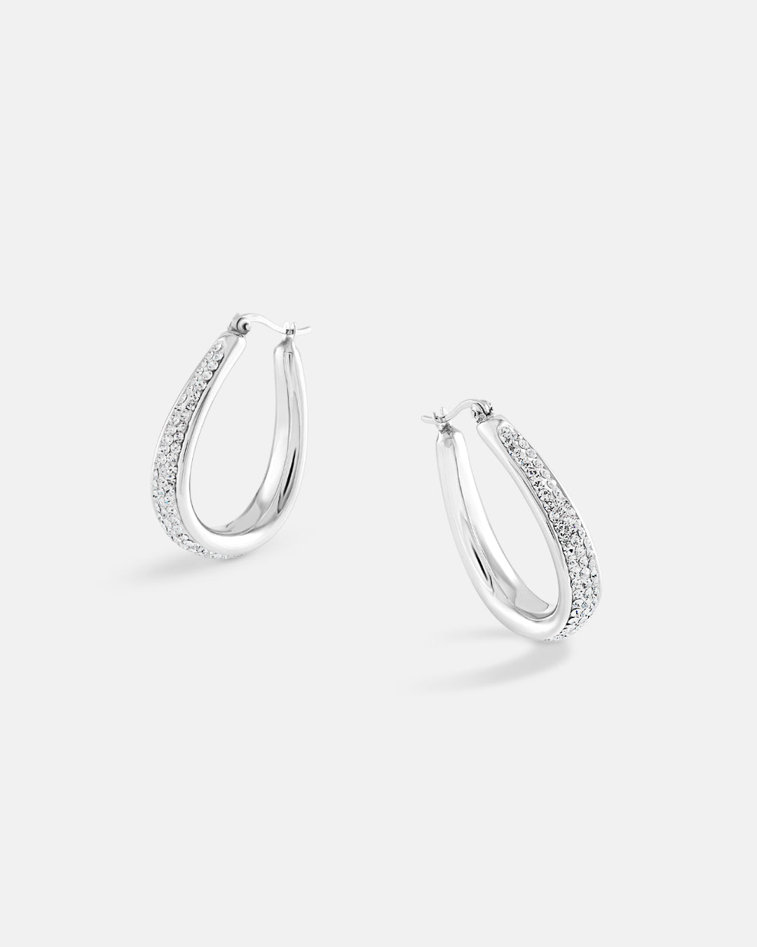 This is the product picture of elegant hoop earrings with micro pavé crystals plated in white gold in sterling silver material