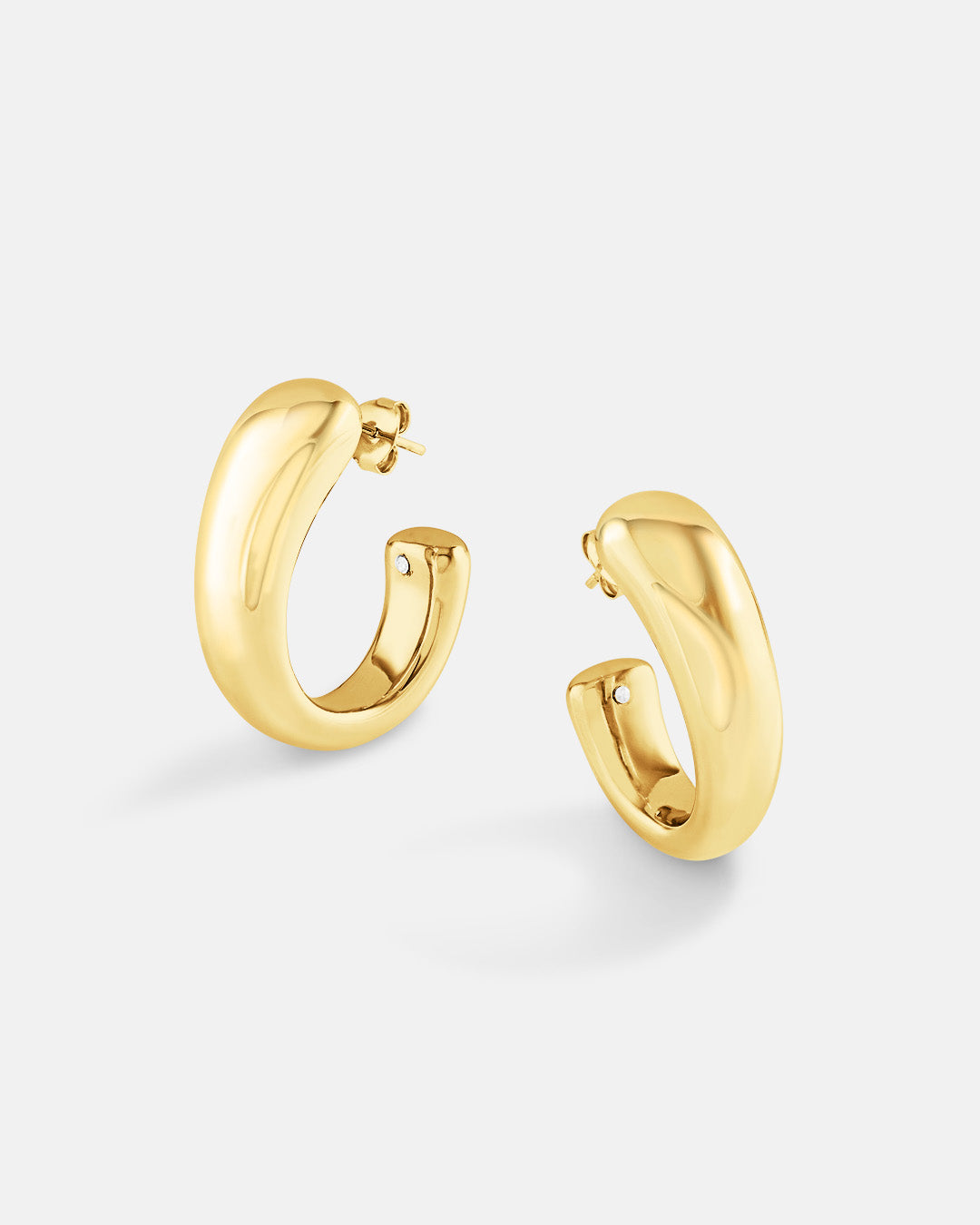 This is the product picture of chunky hoop earrings plated in gold in sterling silver material