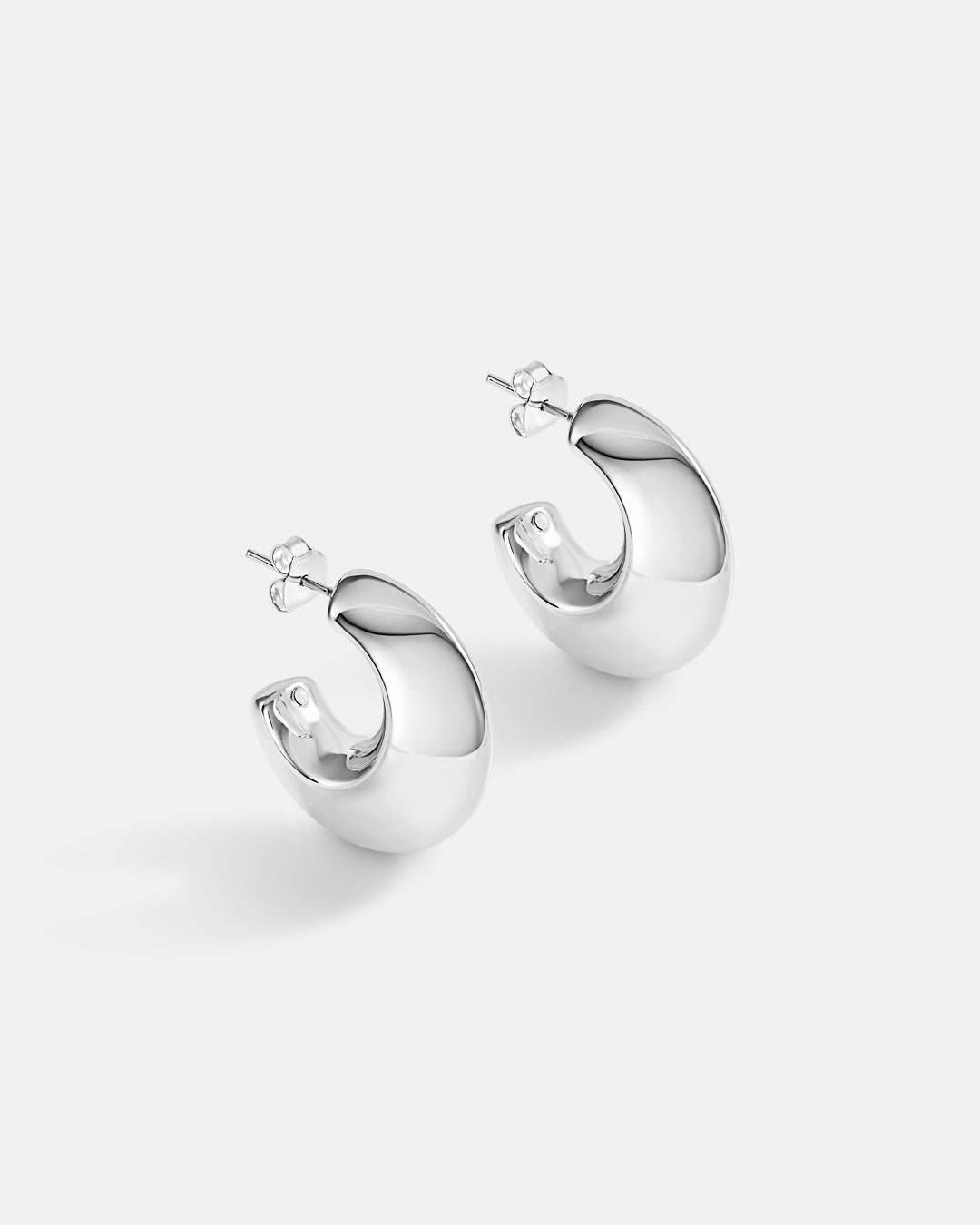 This is the product picture of chunky hoop earrings plated in white gold in sterling silver material