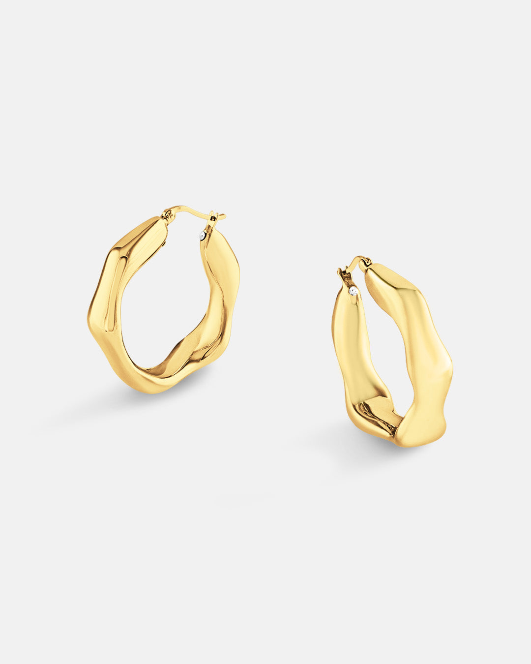 This is the product picture of heptagon shape hoop earrings plated in gold in sterling silver material