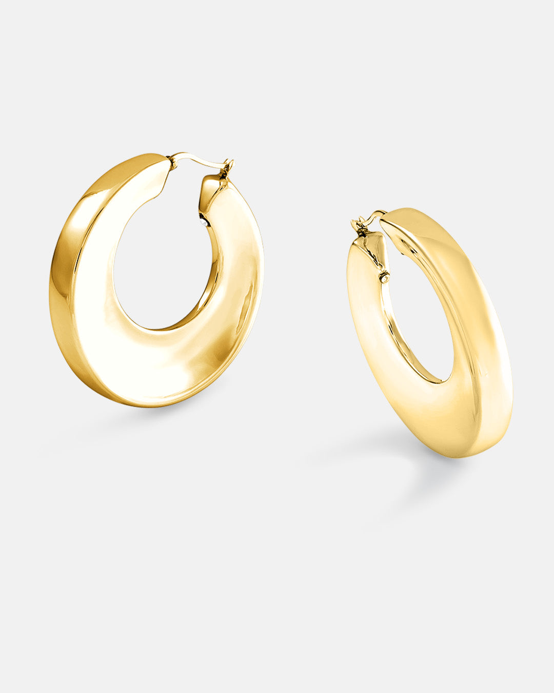 This is product picture of a large round shape organic hoop earrings with a slightly chunky look plated in gold in sterling silver material