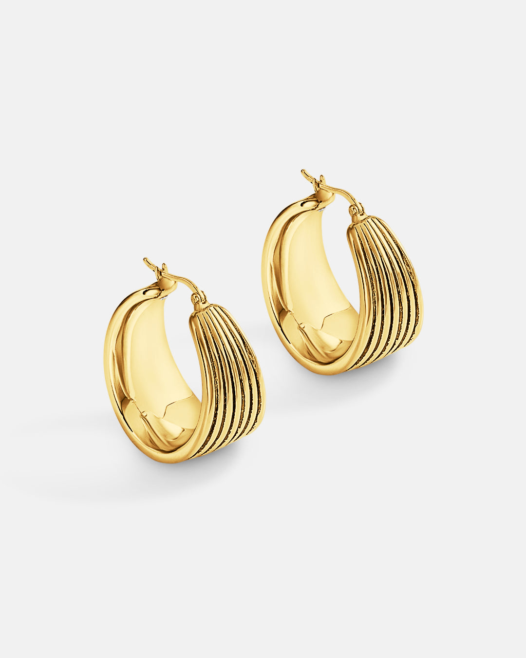 This is the product picture of chunky oxidized line pattern hoop earrings plated in gold in sterling silver material