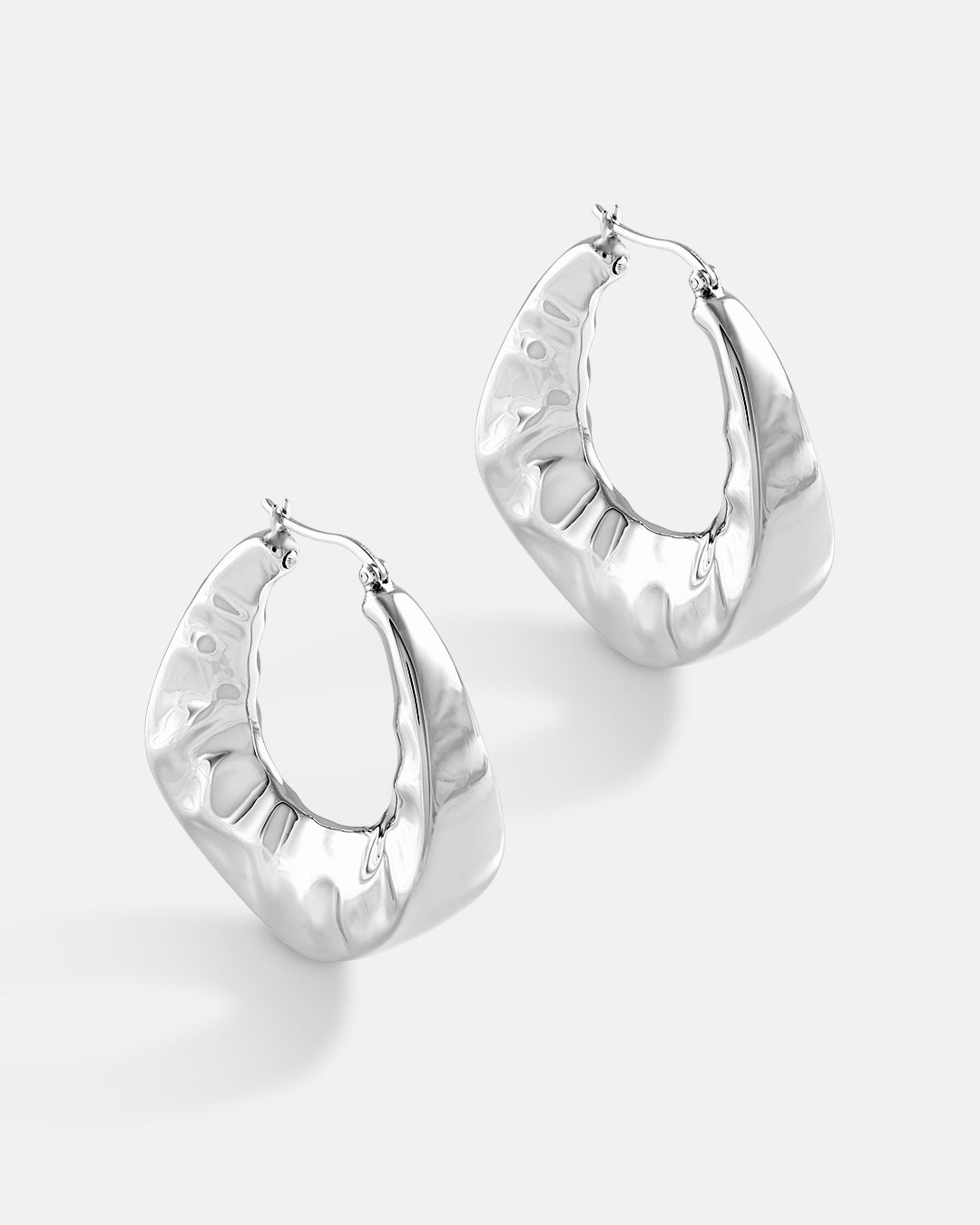 This is the product picture of chunky hoop earrings plated in white gold in sterling silver material