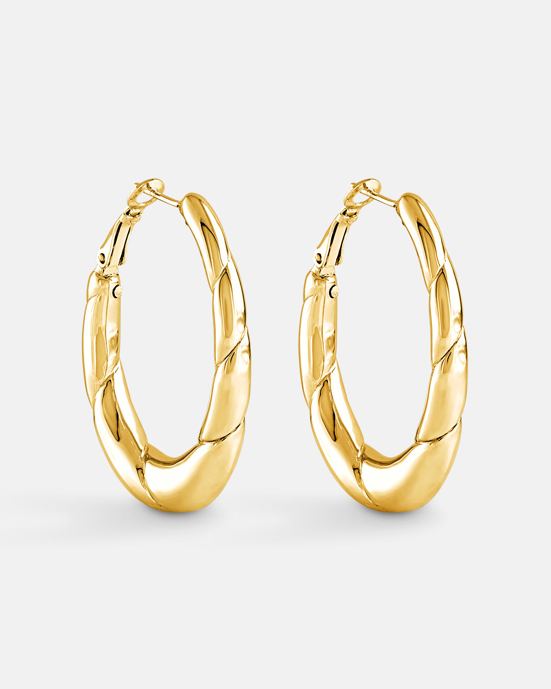 This is the product picture of elongated oval shape hoop earrings plated in gold in sterling silver material