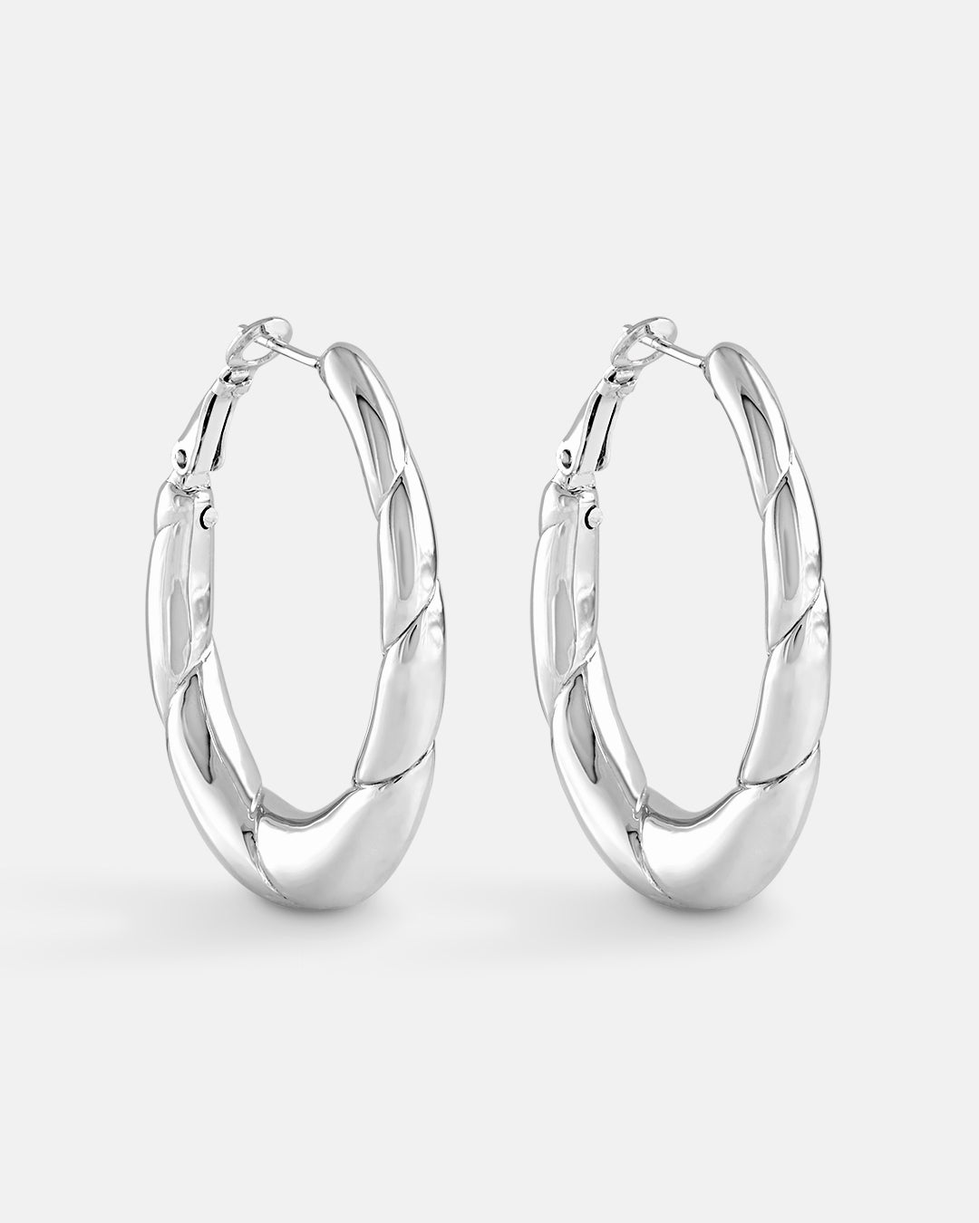 This is the product picture of elongated oval shape hoop earrings plated in white gold in sterling silver material