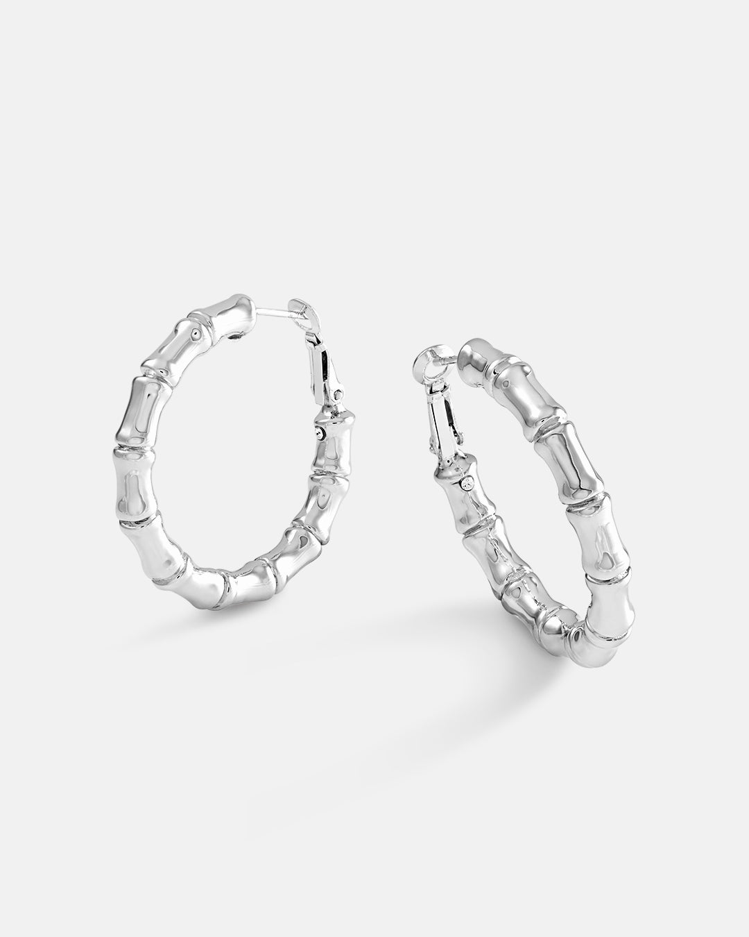 This is the product picture of bamboo style hoop earrings plated in white gold in sterling silver material