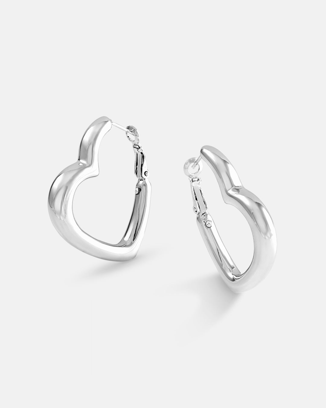 This is the product picture of heart shape design hoop earrings plated in white gold in sterling silver material