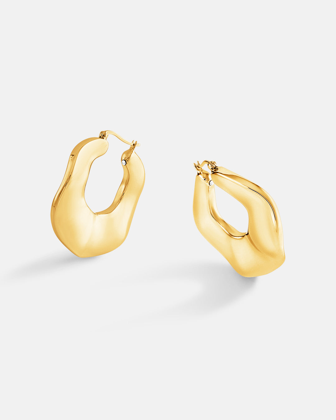 This is the product picture of organic round shape hoop earrings plated in gold in sterling silver material