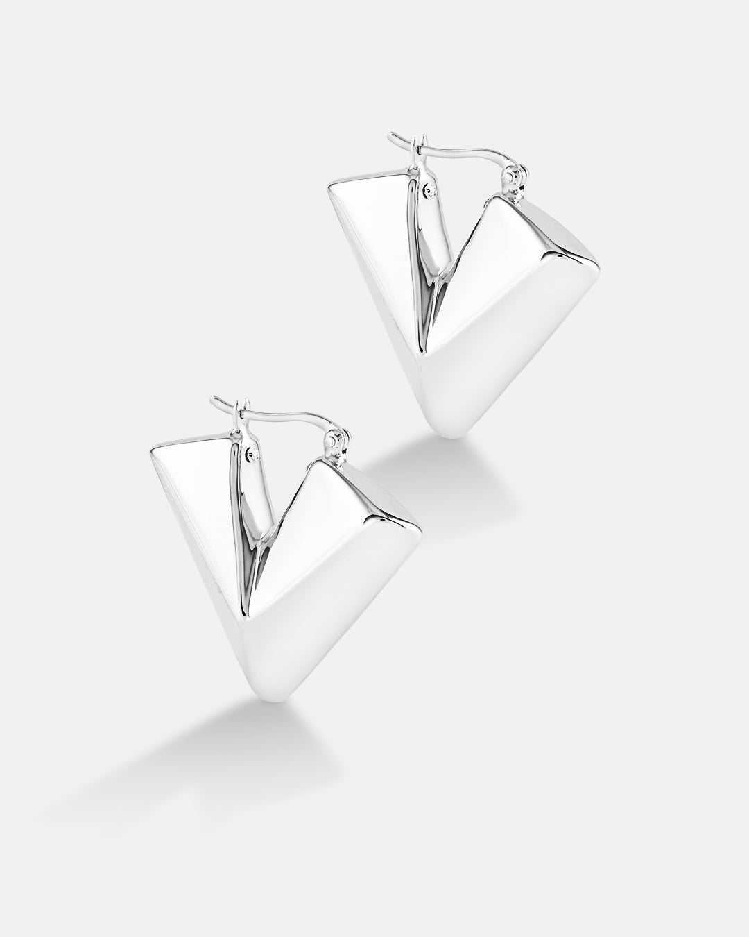 This is the product picture of chunky triangle diamond shape hoop earrings plated in white gold in sterling silver material