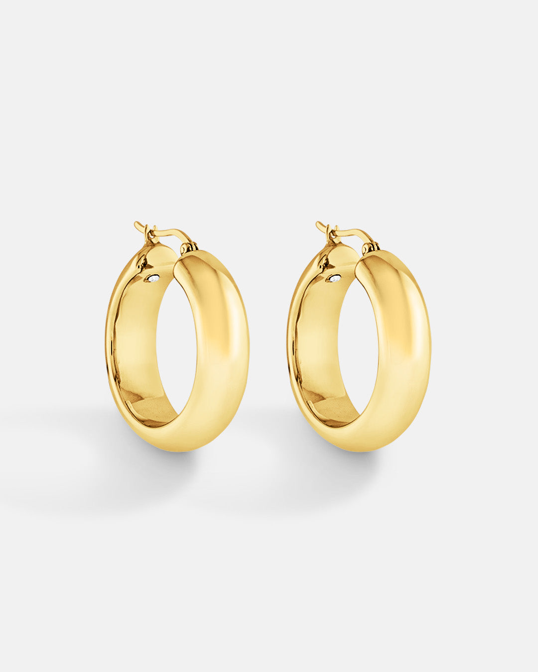 This is the product picture of chunky hoop earrings plated in gold in sterling silver material