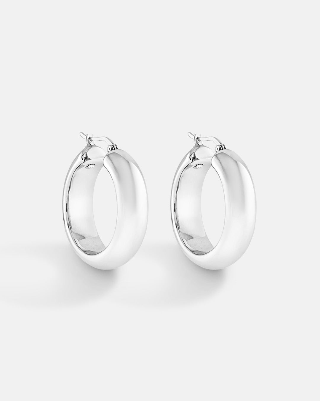 This is the product picture of chunky hoop earrings plated in white gold in sterling silver material
