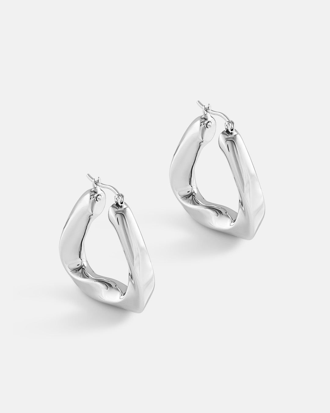 This is the product picture of a triangular twisted chunky hoop earrings plated in white gold in sterling silver material