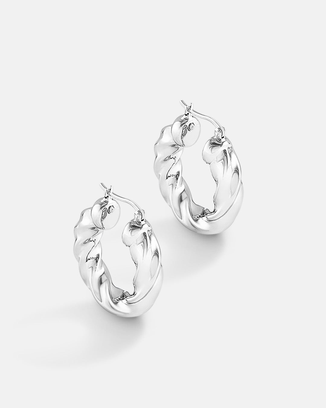 This is the product picture of modern twisted chunky hoop earrings plated in white gold in sterling silver material