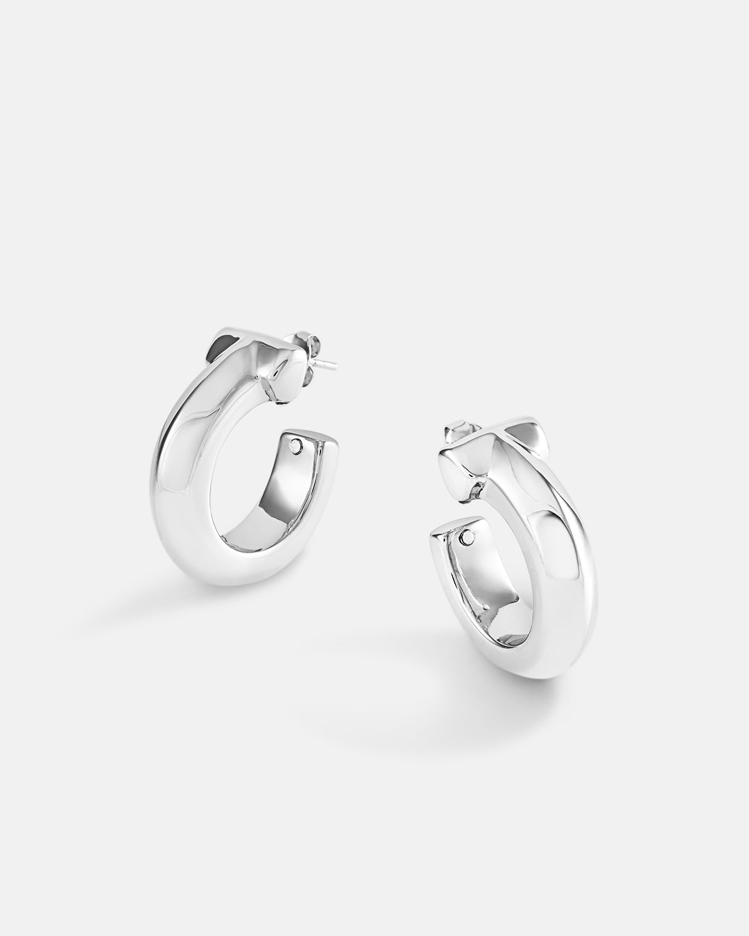 This is the product picture of chunky style hoop earrings plated in white gold in sterling silver material