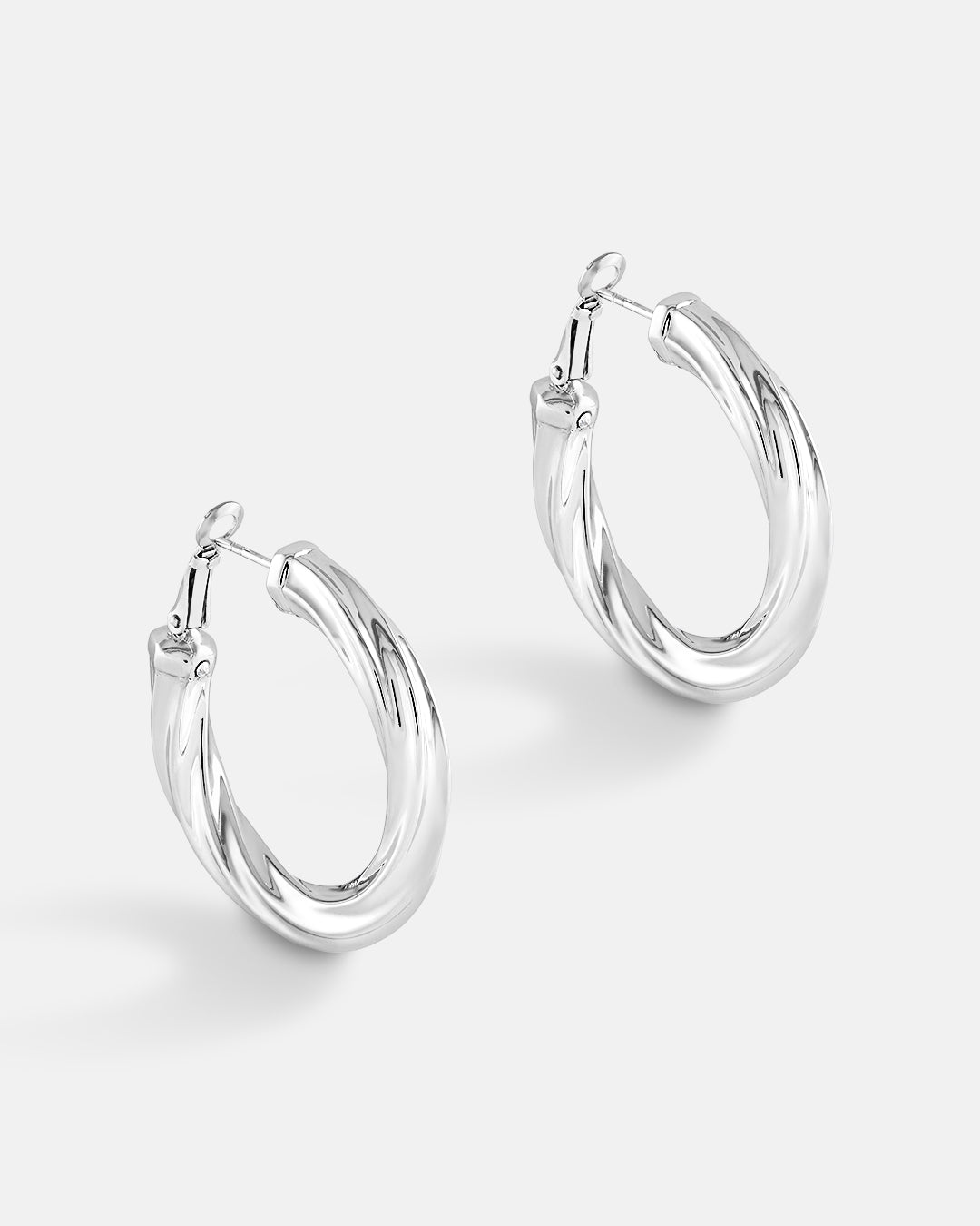 This is the product picture of luxury freeform twisted round shape hoop earrings plated in white gold in sterling silver material